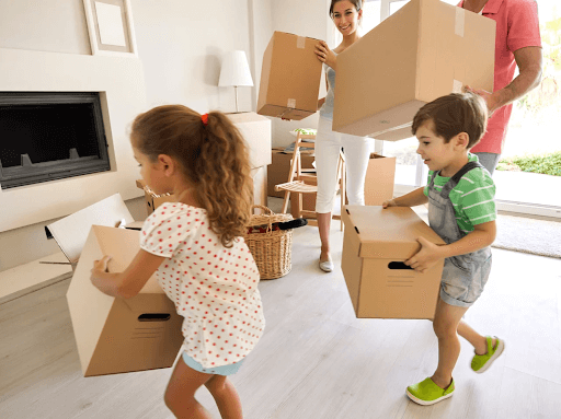 Family holding boxes