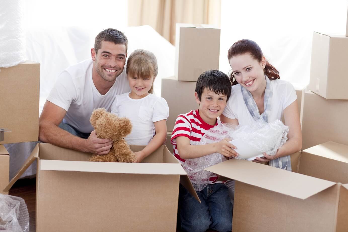 family sitting with boxes